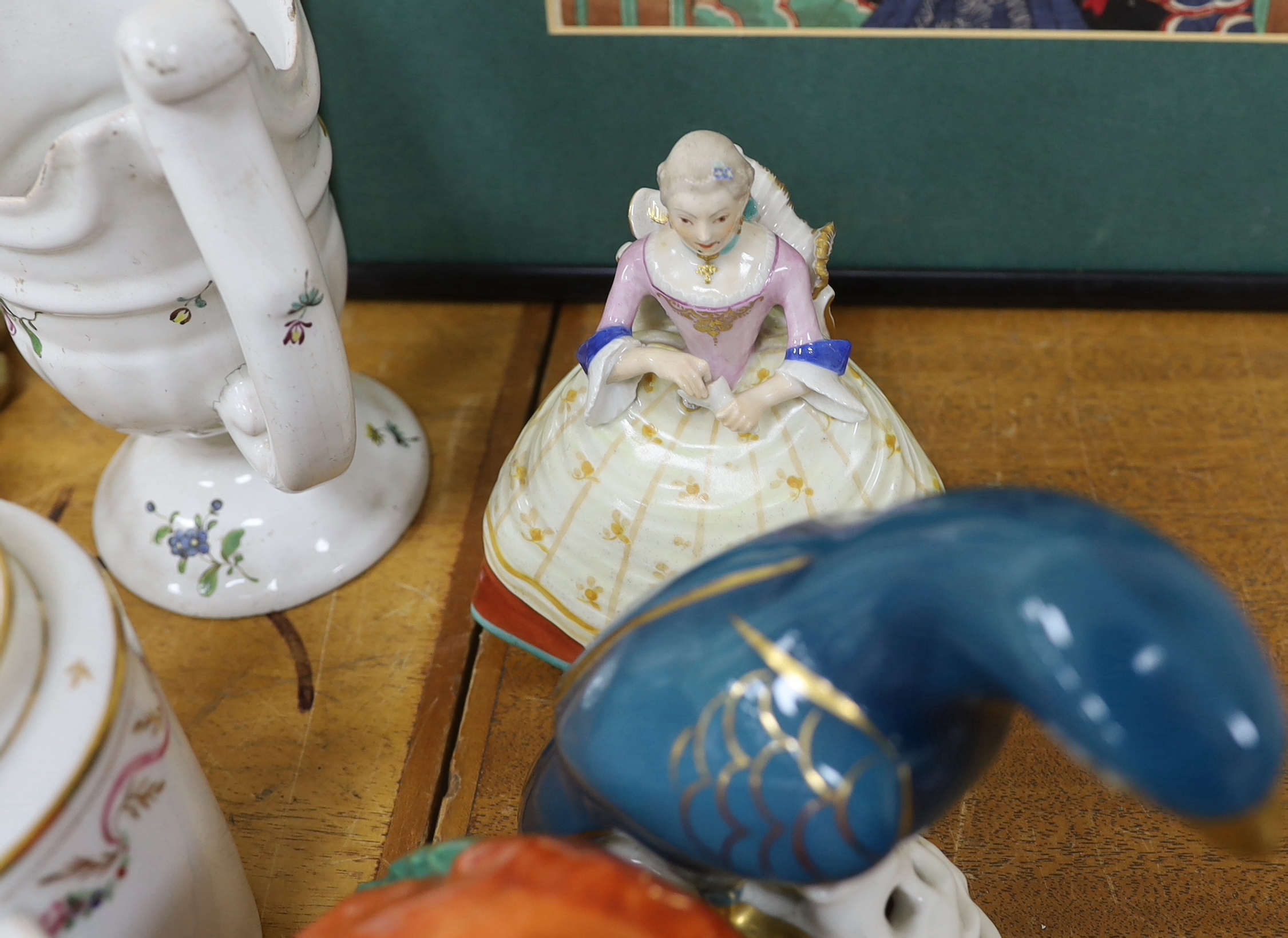 Assorted Continental ceramics, mainly 19th century, including two figures of parrots, two candle holders in the form of musicians, a teapot, jugs, various cups and sauces, etc.